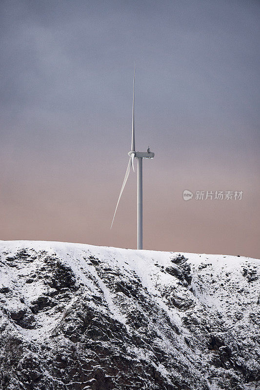 The turbines of a wind farm are seen from the top of Møre og Romsdal in Alesund, Halamseya, Norway.